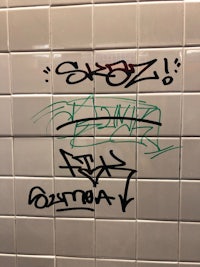 graffiti on the wall of a subway station